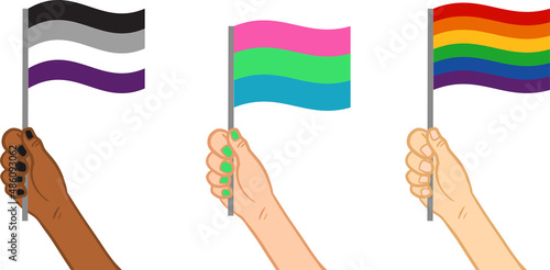 Hands holding LGBT pride and gender identification flags.