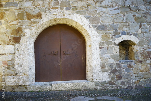 Old Iron portal in a stone wall.