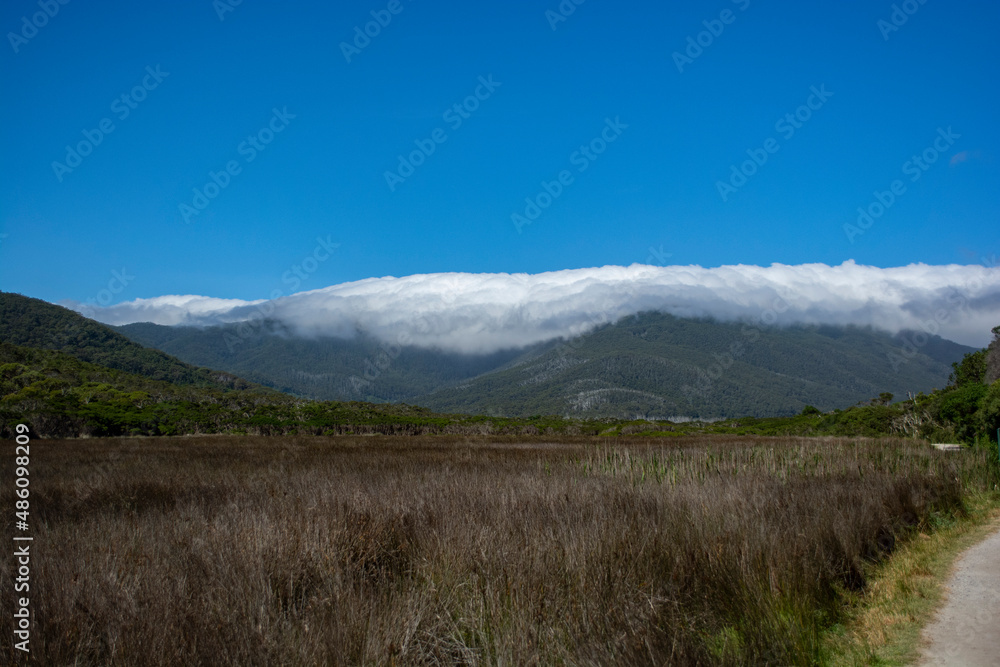 Fototapeta premium Mountain with blanket of clouds