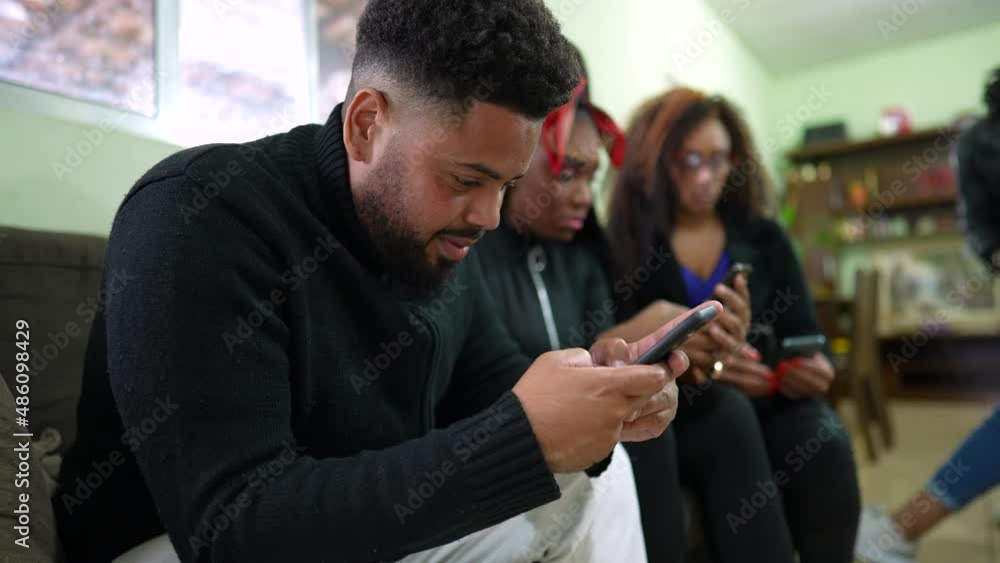 People using phones at casual group looking at smartphone screens People using phones at casual group looking at smartphone screens