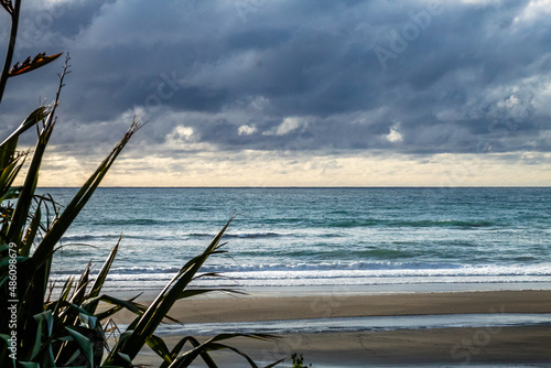 Waves and black sand highlight a visit to the beach. Taranaki, Beach, Taranaki, New Zealand