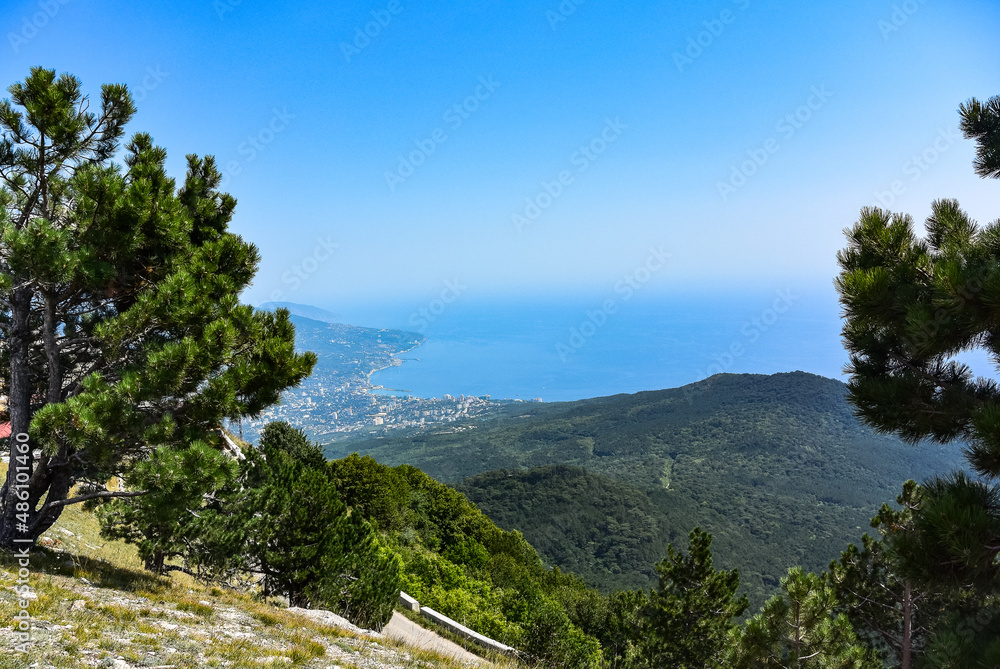 Picturesque view of the city of Yalta and the Black Sea from Ai Petri mountain in the Crimea. Russia.