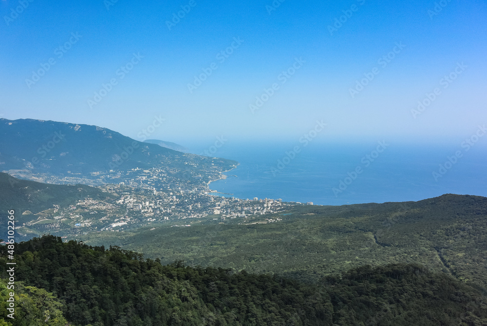 Picturesque view of the city of Yalta and the Black Sea from Ai Petri mountain in the Crimea. Russia.