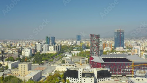A drone view of the skyline of Tirana, Albania. Stadium, Mother Teresa Square, panorama, aerial view, skyscrapers - 4K Drone Video Footage