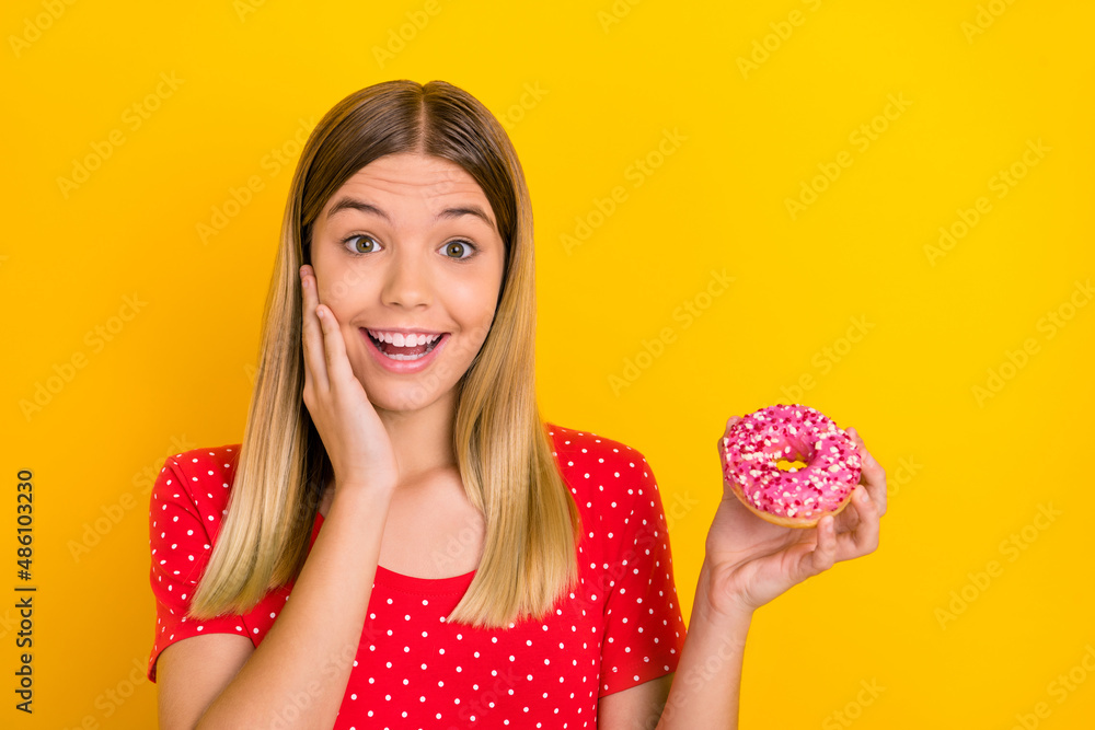 Photo of youth excited lady hand touch cheek yummy pastry dieting isolated over yellow color background Photo of youth excited lady hand touch cheek yummy pastry dieting isolated over yellow color background