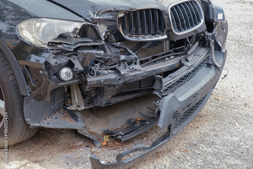 Severely damaged front end of automobile following a collision