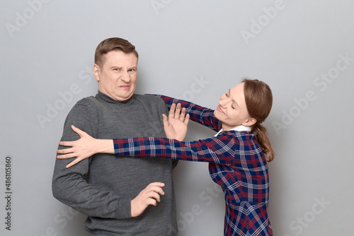 Tablou pe pânză Shot of funny couple, happy cheerful woman and disgruntled man