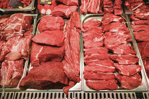 Raw beef and pork for cooking on a shelf in a supermarket. Raw red meat.