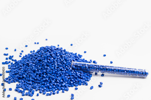 blue granules of polypropylene, polyamide. White background. Plastic and polymer industry. Microplastic products.	