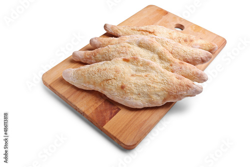 Traditional iraqi bread on a wooden tray