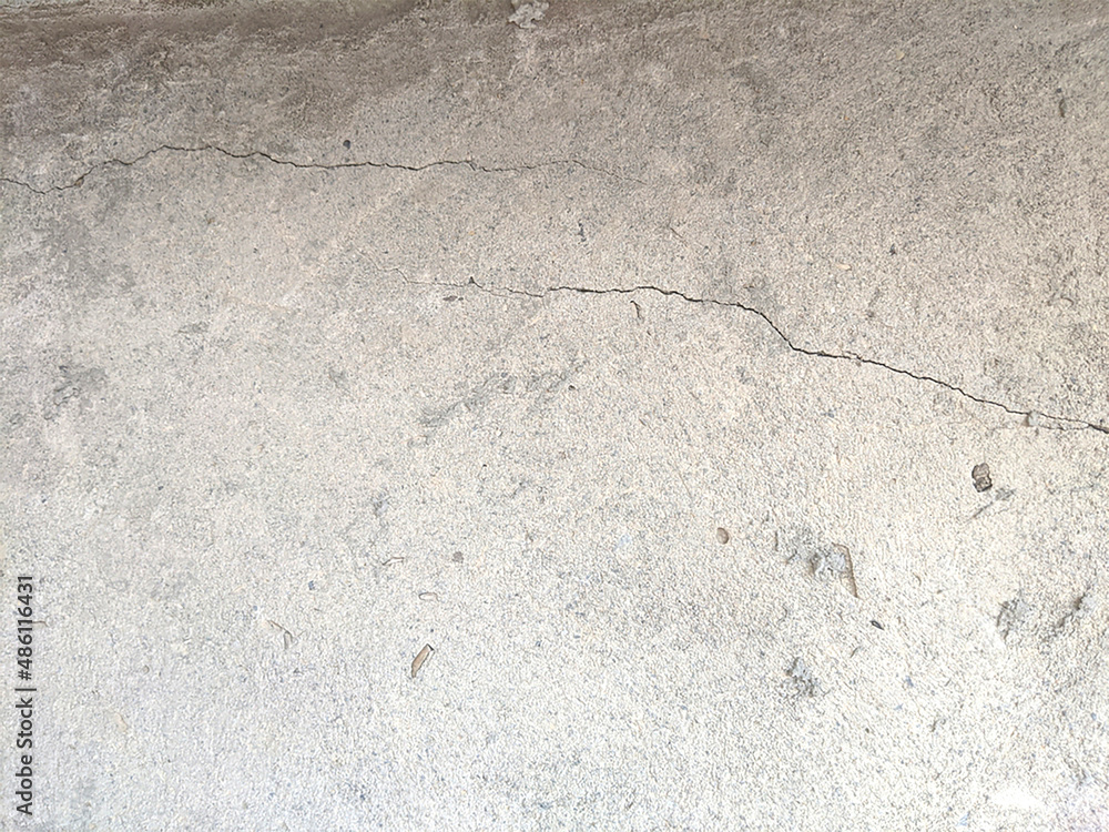 Crack wall texture. Cracked concrete wall covered with cement surface as background. Crack wall texture. Cracked concrete wall covered with cement surface as background.