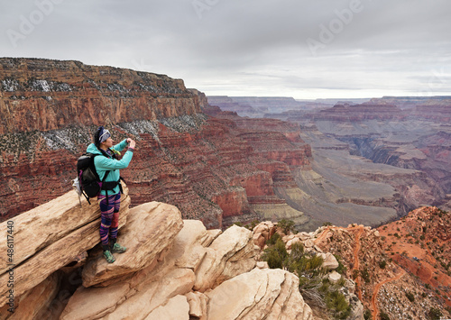 Woman Taking Photo At Ooh Aah Point In The Grand Canyon
