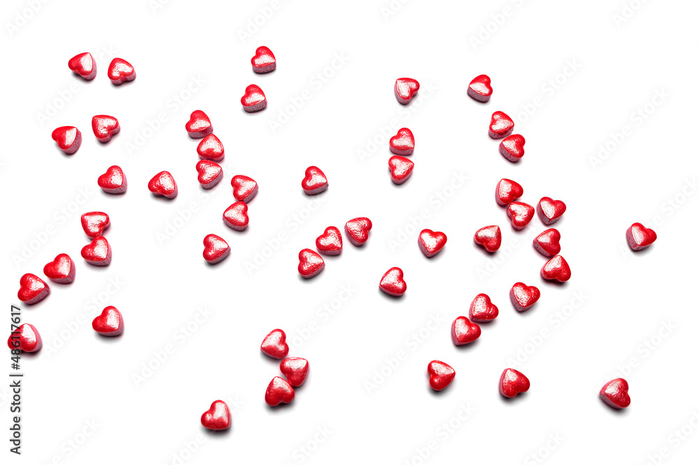 Valentine day isolated white background with red candies hearts. Concept of love, marriage, wedding, Valentine's day, passion. Top view. Valentine day isolated white background with red candies hearts. Concept of love, marriage, wedding, Valentine's day, passion. Top view.