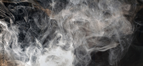 Abstract White smoke blot on black horizontal long background.