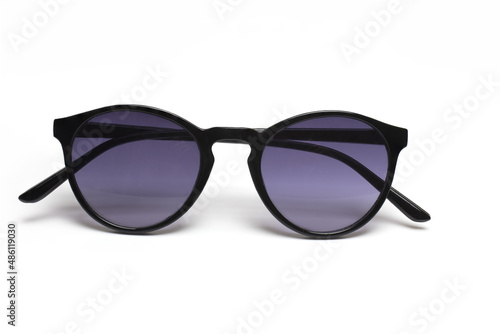 closeup sunglasses plastic dark lenses white background