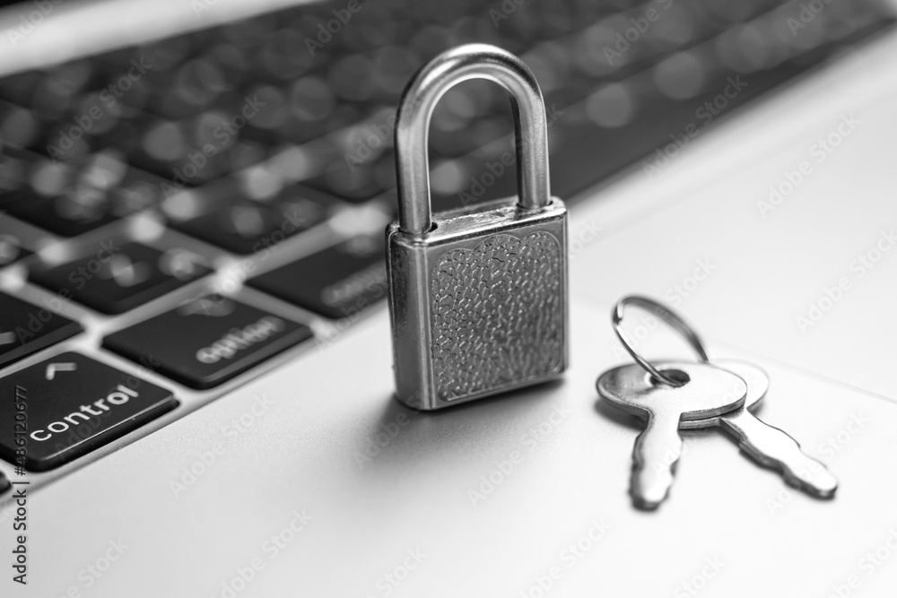 Computer security concept. Padlock with keys on computer keyboard, laptop in office. Cyber security and privacy background photo Computer security concept. Padlock with keys on computer keyboard, laptop in office. Cyber security and privacy background photo