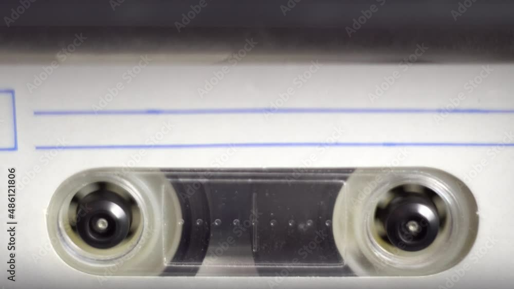 Rewinding an audio cassette. Tape deck. tape rotation. Retro