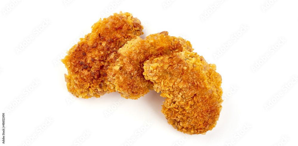 Fried Tasty Crispy Breaded Chicken Nuggets with basil leaves and spicy sauce, close-up, isolated on a white background. Fried Tasty Crispy Breaded Chicken Nuggets with basil leaves and spicy sauce, close-up, isolated on a white background.