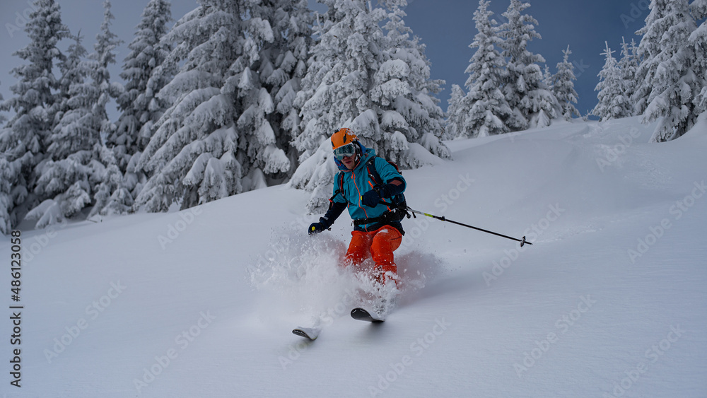Skialpinist skiing in fresh deep snow. Skialpinist skiing in fresh deep snow.