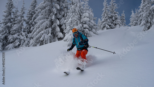 Skialpinist skiing in fresh deep snow.