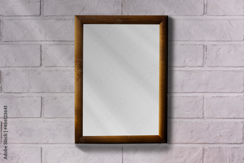 Photo frame on a brick wall. Clean background. Photo frame on a brick wall. Clean background.