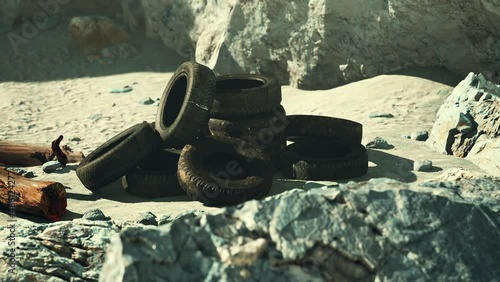 Old car tires on the beach
