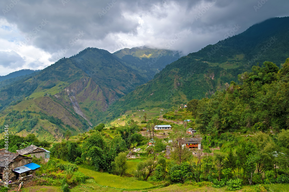 Mountain views of the Tatopani area during trekking around Annapurna (Annapurna Circuit), village with mountains in background. Himalaya, Nepal. Mountain views of the Tatopani area during trekking around Annapurna (Annapurna Circuit), village with mountains in background. Himalaya, Nepal.