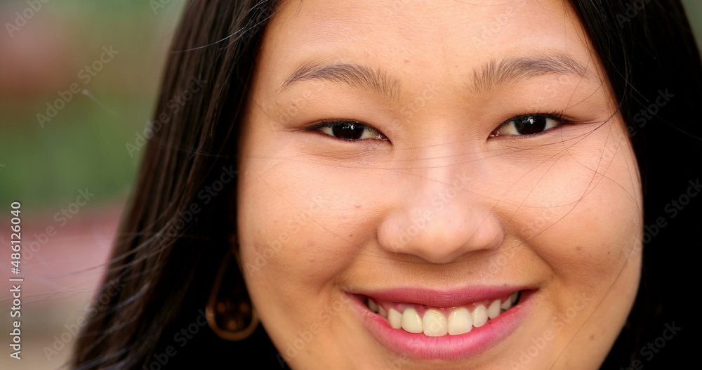 Happy Asian large young woman smiling at camera close-up portrait face Happy Asian large young woman smiling at camera close-up portrait face