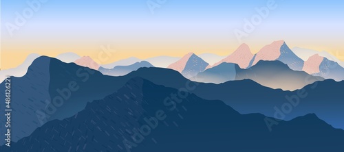 Beautiful sunset mountain view with fog.