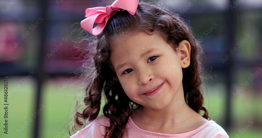 Cute little girl child portrait close-up face outside at park Cute little girl child portrait close-up face outside at park