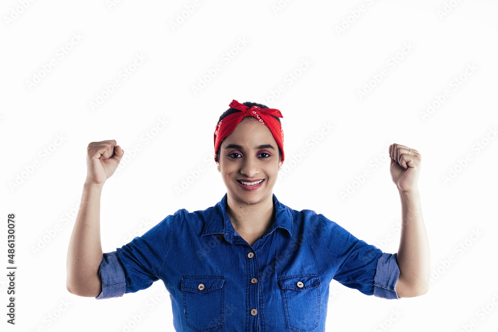 Hispanic woman raising her arms with a happy fist, on white background. Hispanic woman raising her arms with a happy fist, on white background.