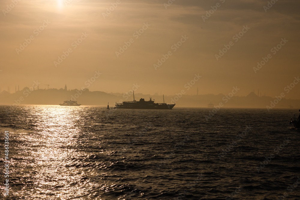 Istanbul photo. Ferry and cityscape of Istanbul in foggy weather
