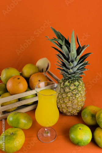 tropical fruits to prepare a natural juice. glass of juice with fruits