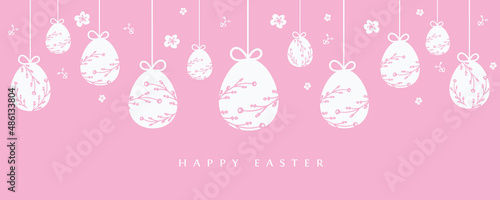 Easter banner with hanging eggs decoration on pastel pink background. © Irina