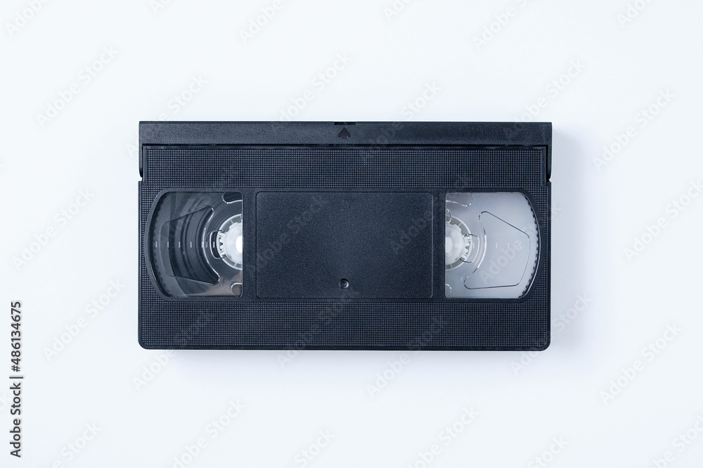 Black plastic video cassette on white background.
