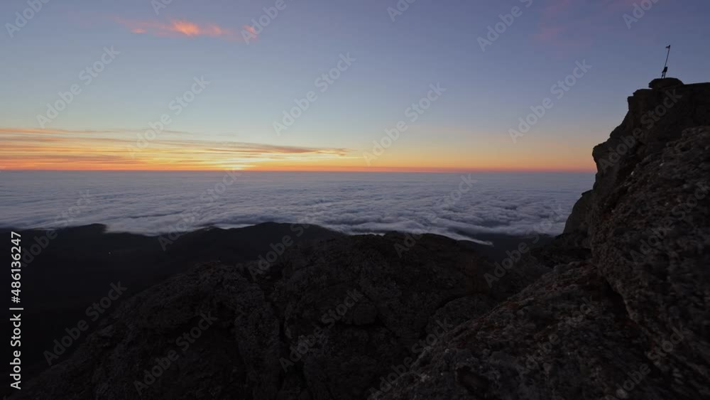 Sunrise at the peak of mountain in autumn among white clouds and sun. Timelapse Sunrise at the peak of mountain in autumn among white clouds and sun. Timelapse