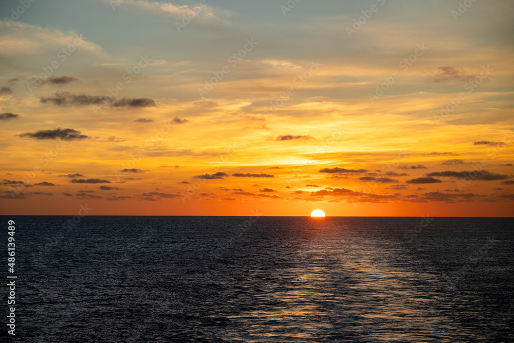 Colorful sunrise at sea from cruise ship