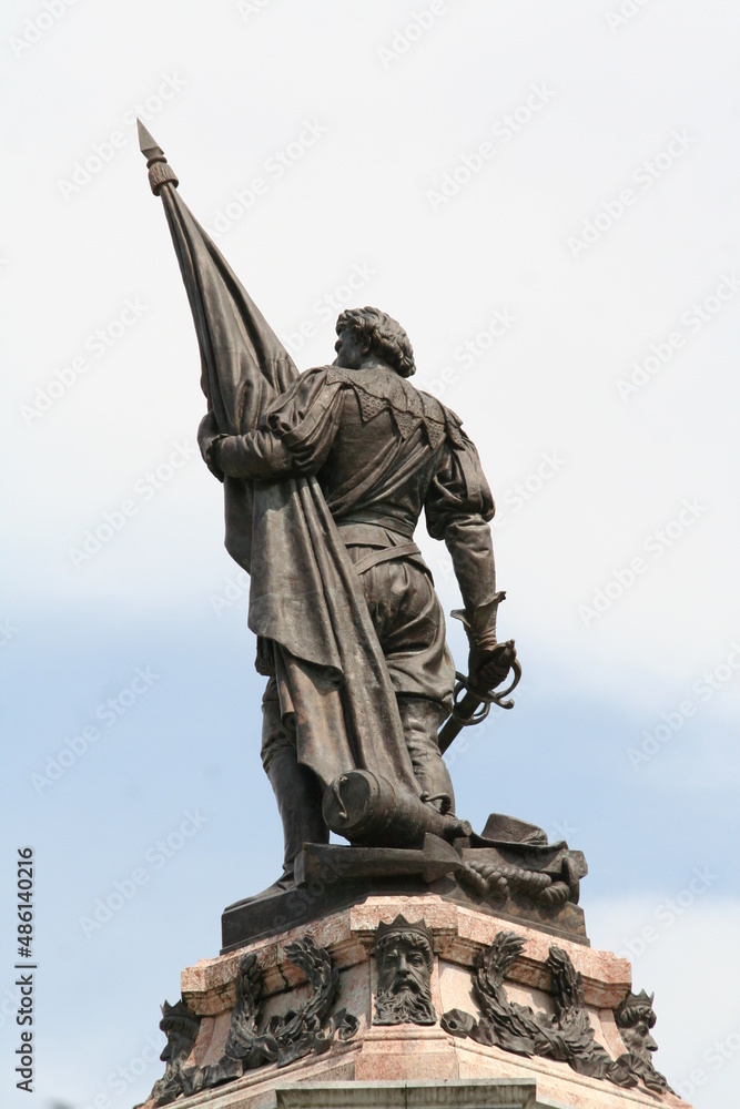 Artistic decorative scupture of a man with a flag in San Sebastian Spain