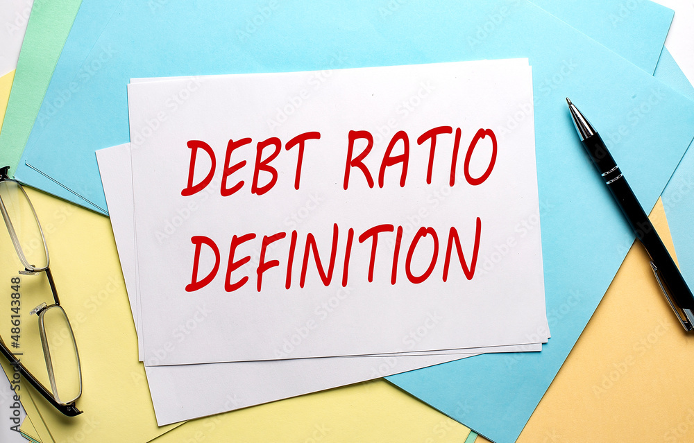 DEBT RATIO DEFINITION text on paper on the colorful paper background DEBT RATIO DEFINITION text on paper on the colorful paper background