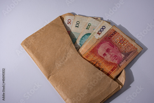 old brazilian money, cruzeiros in a brown envelope	 photo