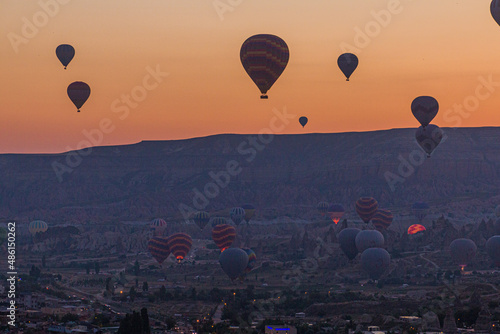 Early morning view of hot air balloons above Goreme village in Cappadocia, Turkey