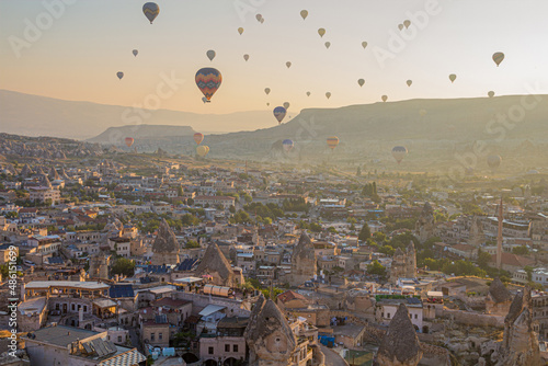 Hot air balloons above Goreme town in Cappadocia, Turkey
