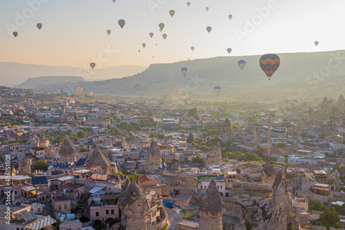 Hot air balloons above Goreme village in Cappadocia, Turkey