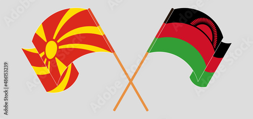 Crossed and waving flags of North Macedonia and Malawi