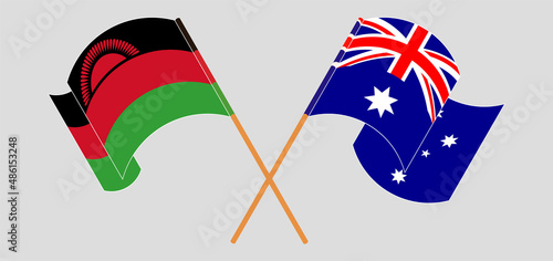 Crossed and waving flags of Australia and Malawi