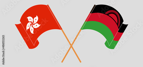 Crossed and waving flags of Hong Kong and Malawi