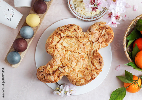 Colomba - traditional italian easter dove cake with glaze, macaranage, almonds