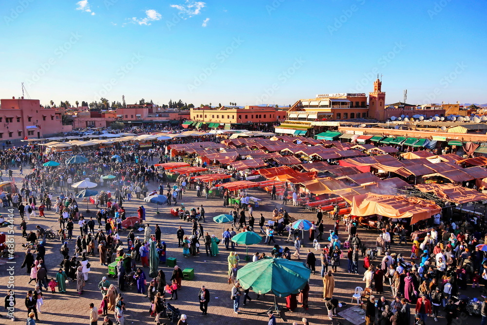 Fototapeta premium MARRAKECH, MOROCCO - 6 March 2016: Famous Jemaa el Fna square crowded at dusk. Marrakesh, Morocco