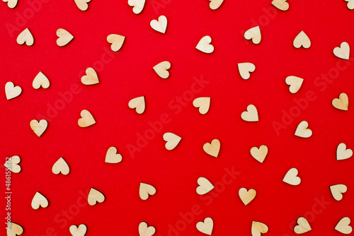 pattern with hearts, Valentines day, little wooden hearts on red background