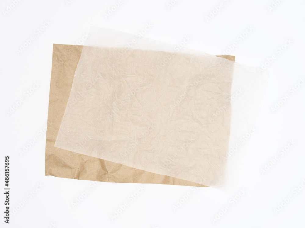 Abstract brown recycled crumpled paper and crumpled tracing paper isolated on white background.